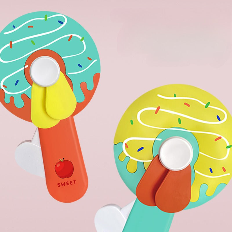 Donut Kid Fan �Cute Handheld Mini Fan for Kids | Portable Cartoon Fan for School, Travel & Outdoor Use (Random Color)