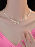 PQT-992 - Bow Shape Pearl Pendant Necklace for Women �Dainty Jewelry with Sparkling Bow Design | Available in Silver &amp; Golden Finish | Perfect Gift for Weddings, Parties &amp; Everyday Glamour - Golden