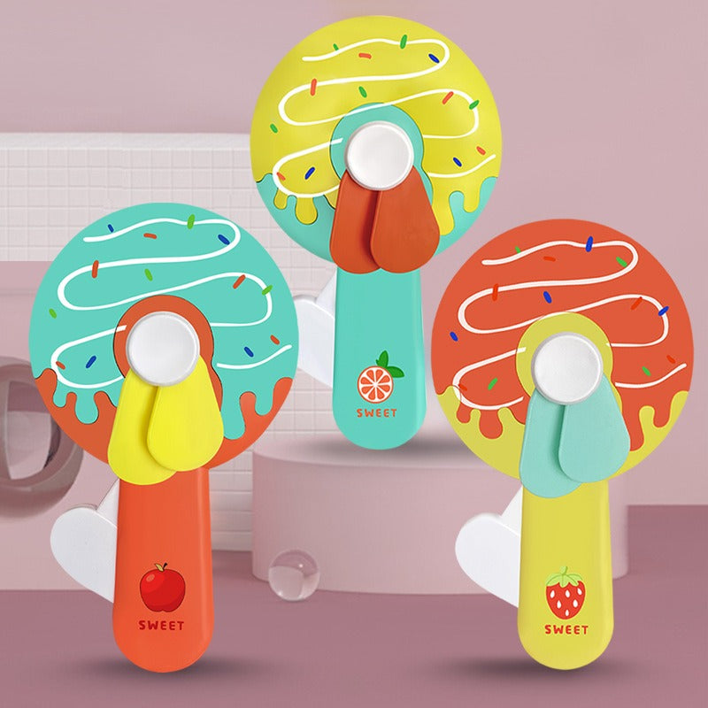 Donut Kid Fan �Cute Handheld Mini Fan for Kids | Portable Cartoon Fan for School, Travel & Outdoor Use (Random Color)