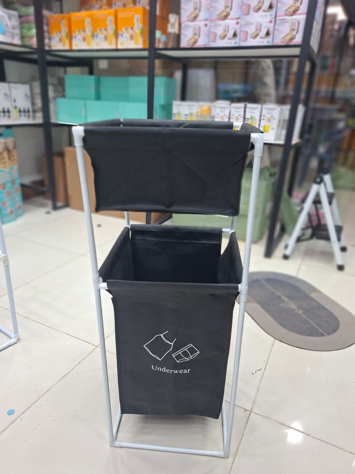 Fabric Laundry Hamper With Dual Compartments And White Metal Frame For Organized Clothing And Underwear Storage